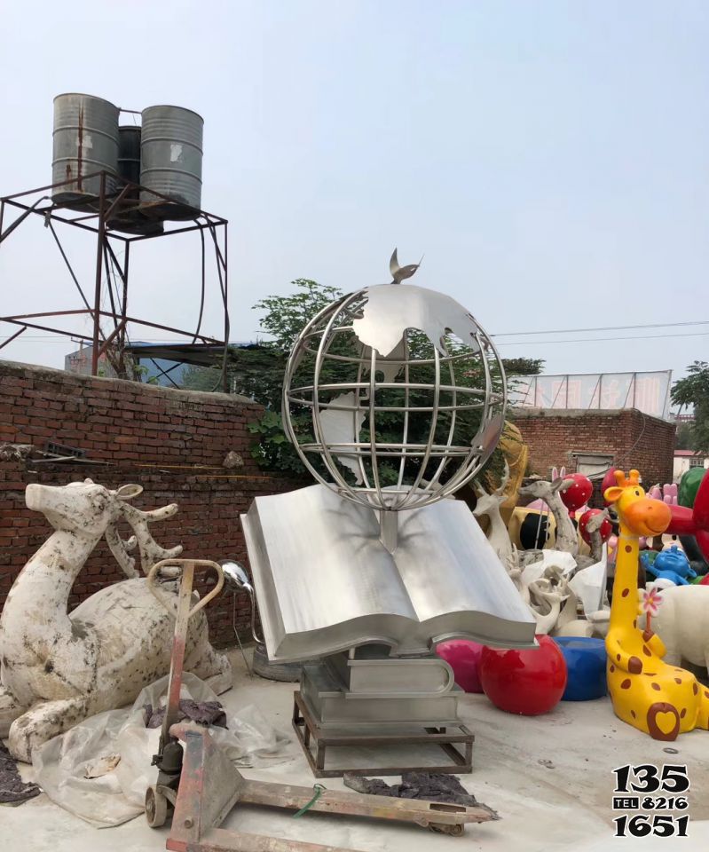 地球儀雕塑-戶外廣場不銹鋼制品書本上的鏤空地球儀雕塑 地球儀雕塑-戶外廣場不銹鋼制品書本上的鏤空地球儀雕塑高清圖片