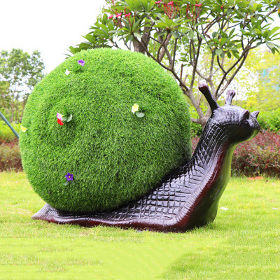 蝸牛雕塑-公園擺放的一只超大的半植物玻璃鋼創意蝸牛雕塑 蝸牛雕塑-公園擺放的一只超大的半植物玻璃鋼創意蝸牛雕塑高清圖片